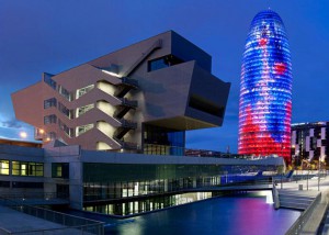 Museu del Disseny and the Torre Agbar light up Poblenou at night