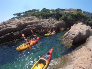 kayaks between rocks