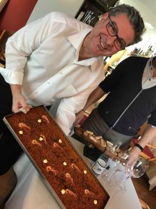 Waiter with paella tray